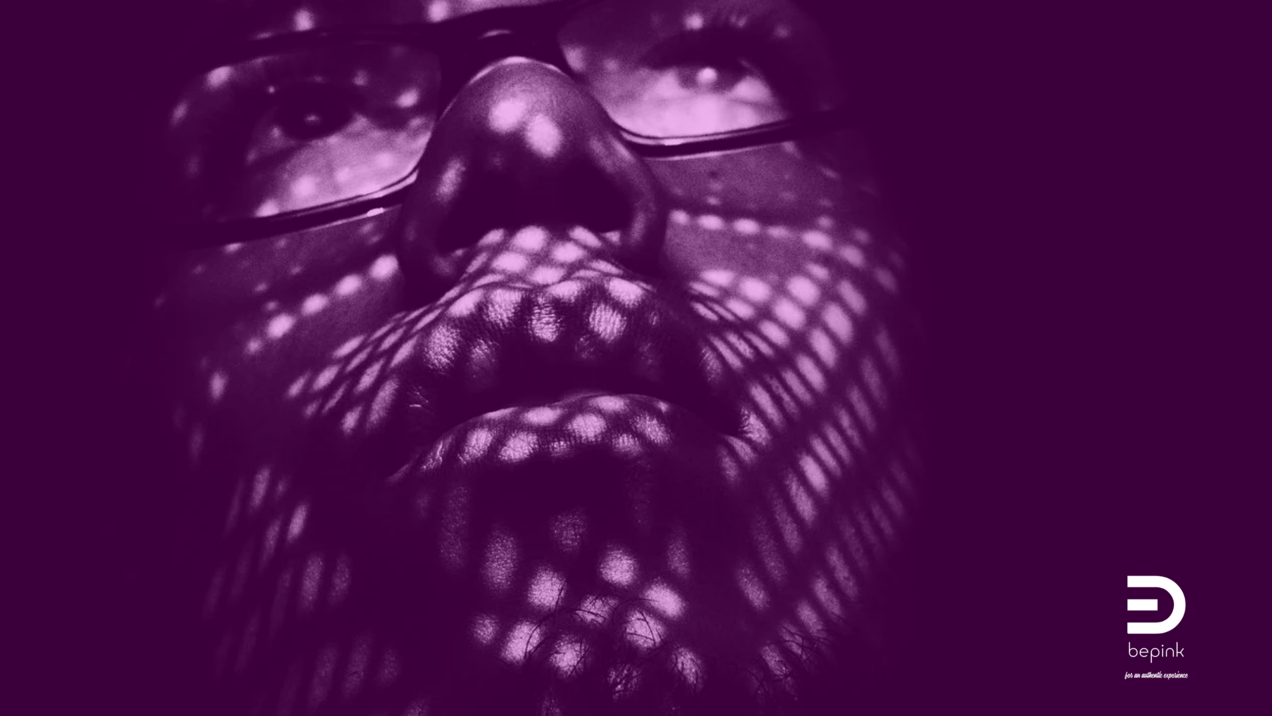 Close-up portrait with geometric light patterns on the face representing how social norms become embodied and internalized